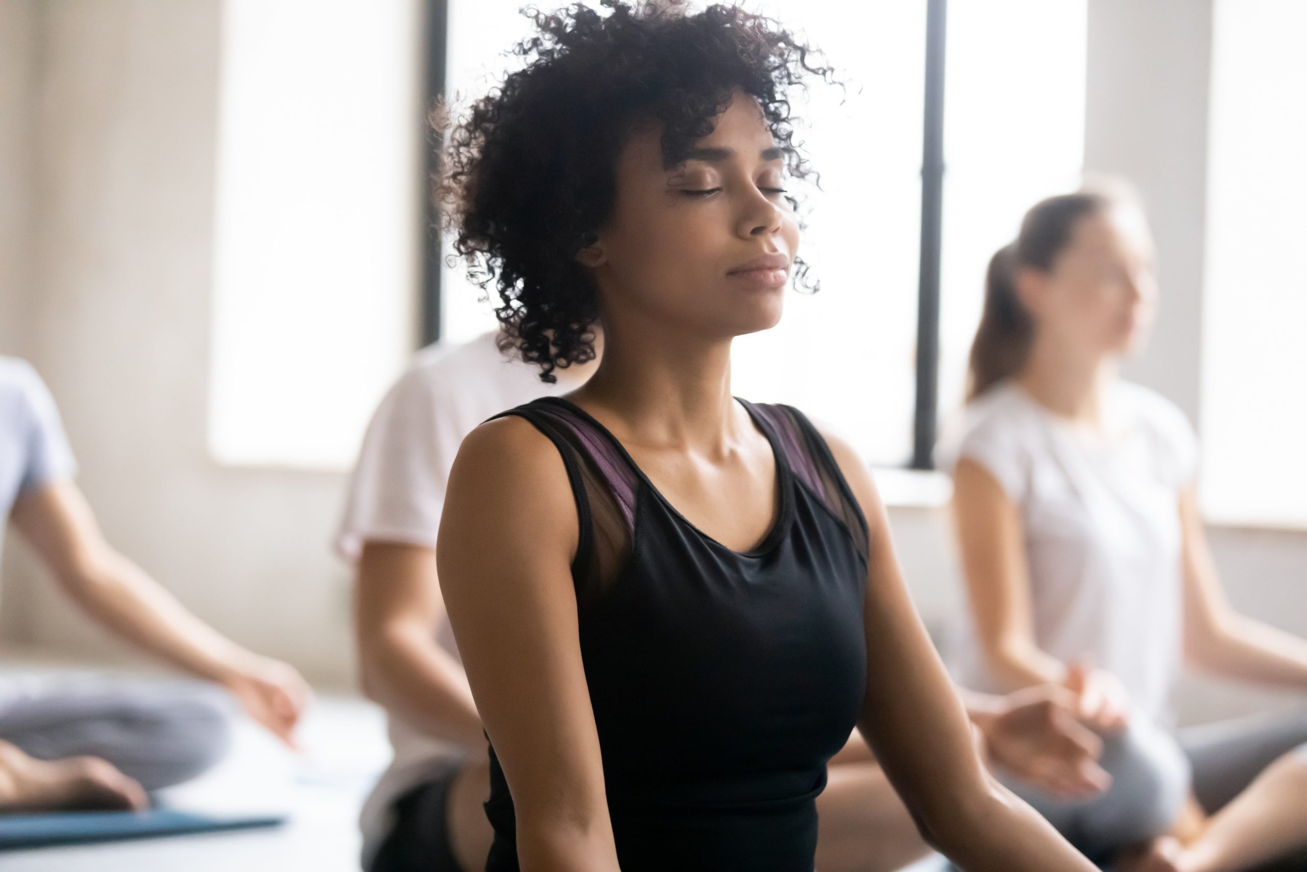 woman-meditates-yoga-class-1-scaled