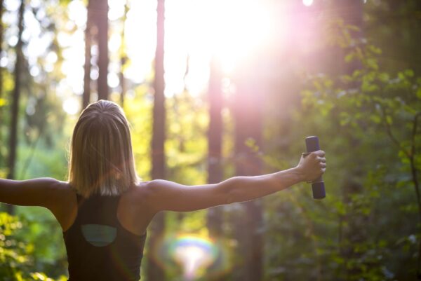 Woman Working Out Dumbbells In Beautiful Nature Scaled