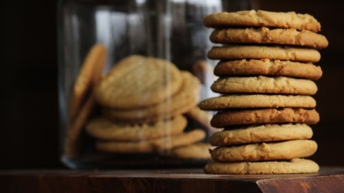 Full peanut butter cookie jar and stacked cookies. Google 3rd party cookie announcement